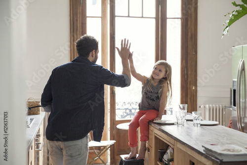 Father and daugther high-five photo