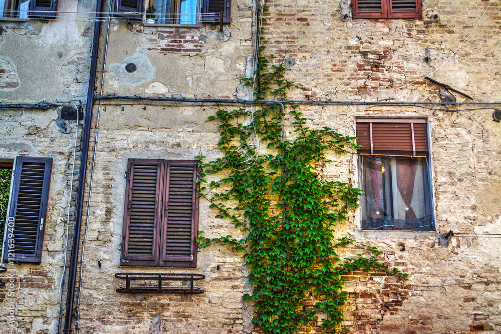 windows in a rustic wall in Tuscany