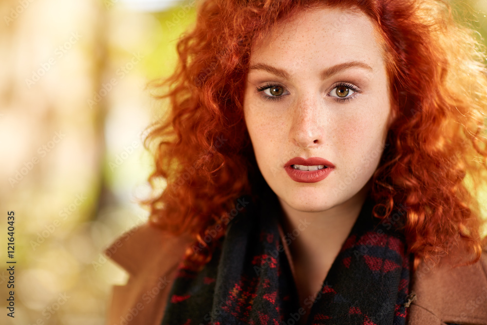Portrait of attractive redhead girl