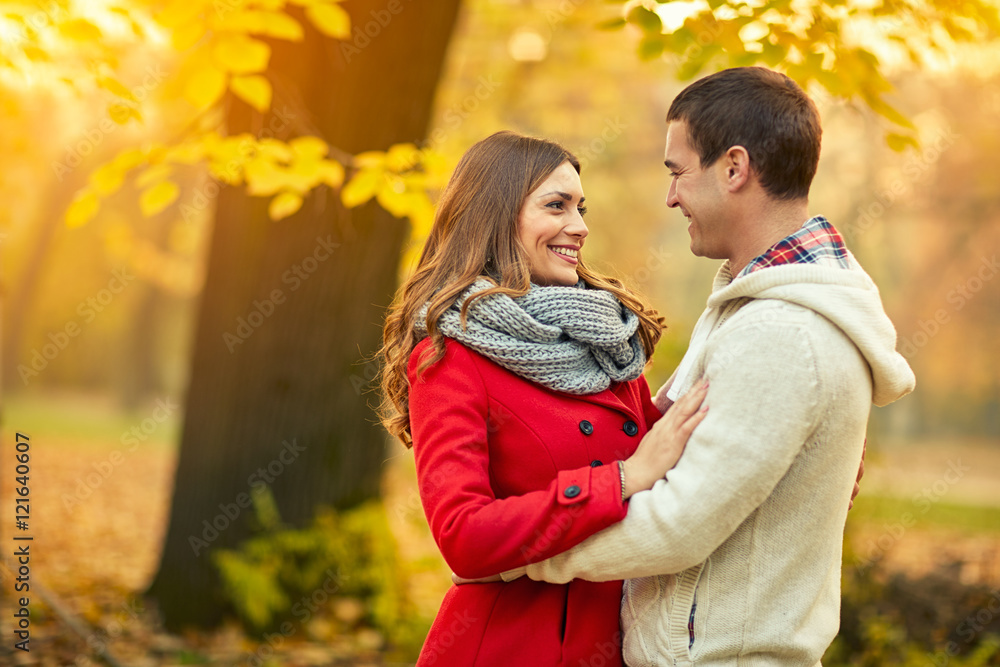 Fototapeta premium Cheerful couple in love in park