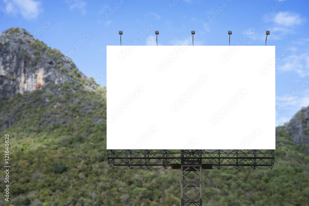 Blank big billboard against green mountain and blue sky background,for your advertising,put your own text here,isolate white on board Blank big billboard against green mountain and blue sky background,for your advertising,put your own text here,isolate white on board