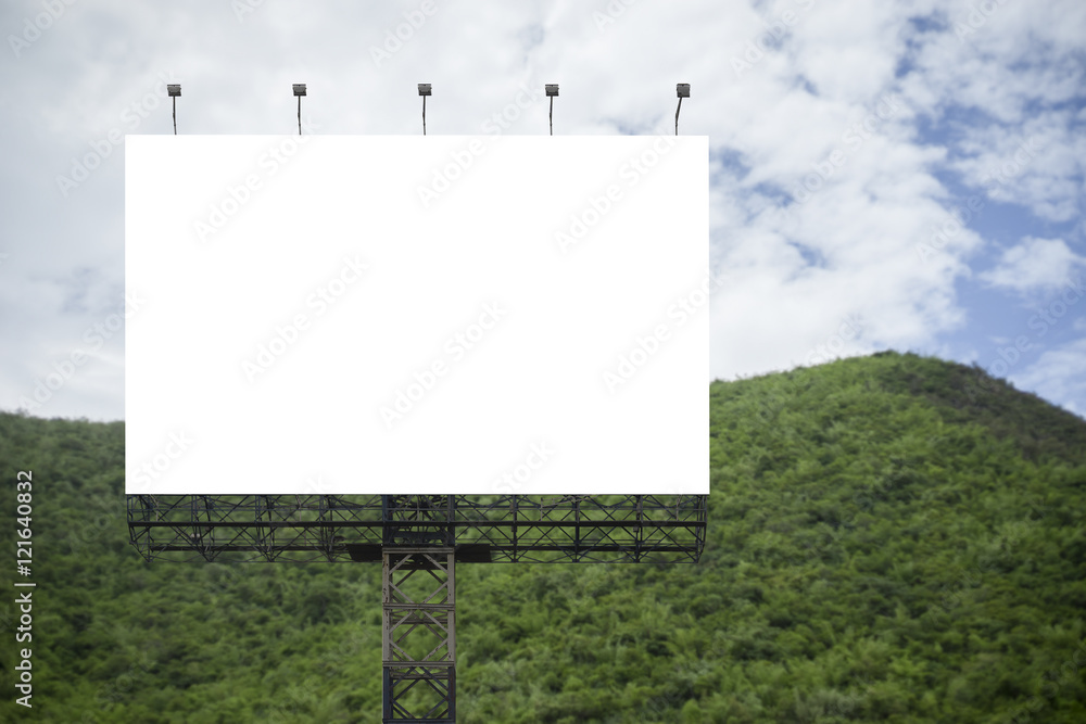 Blank big billboard against green mountain and blue sky background,for your advertising,put your own text here,isolate white on board Blank big billboard against green mountain and blue sky background,for your advertising,put your own text here,isolate white on board