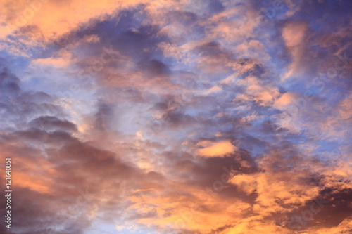 Fototapeta Naklejka Na Ścianę i Meble -  Fiery sunset with orange cloud and blue sky