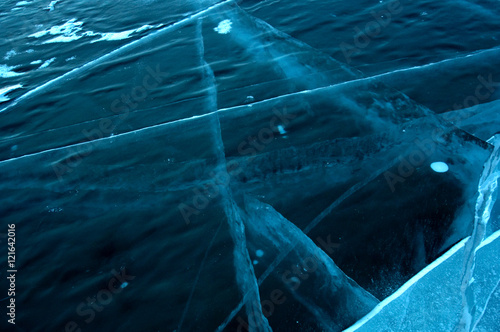 Fototapeta Naklejka Na Ścianę i Meble -  icy surface of Lake Baikal. crack and scratches on clear ice