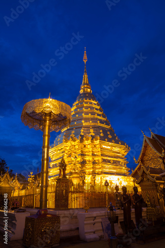 golden pagoda in twilight of wat phra that doi suthep . The most
