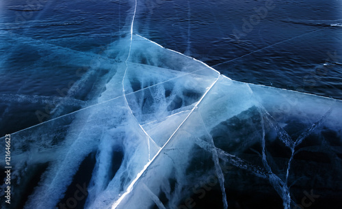Winter. Ice on the surface of Lake Baikal. Ice thickness of about one meter. Cracks in the ice surface. Ice storm. Used toning of the photo.