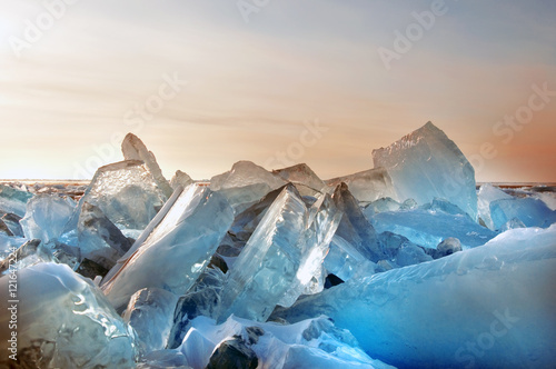 Winter. Extremal cracks on Ice of Lake Baikal. thickness of about one meter. . Ice storm. Used toning of the photo.  photo