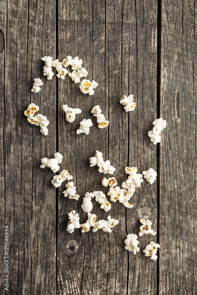 Popcorn on wooden table. Popcorn on wooden table.