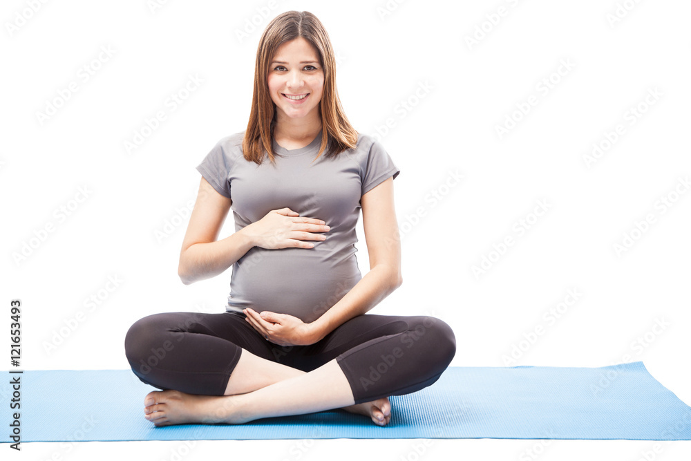 Pretty pregnant practicing some yoga