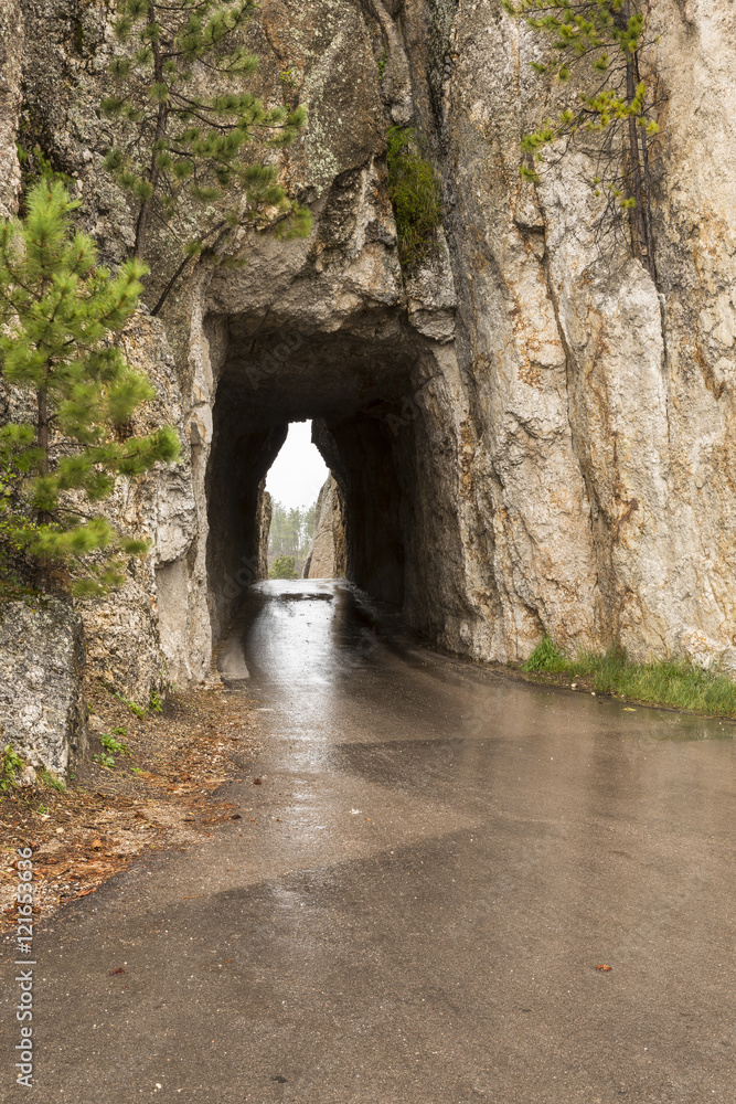 Needles Tunnel / A narrow tunnel on a road.