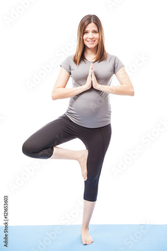 Pregnant woman practicing some yoga