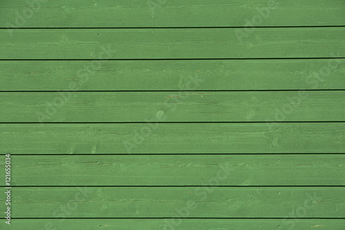Green painted wood panel.