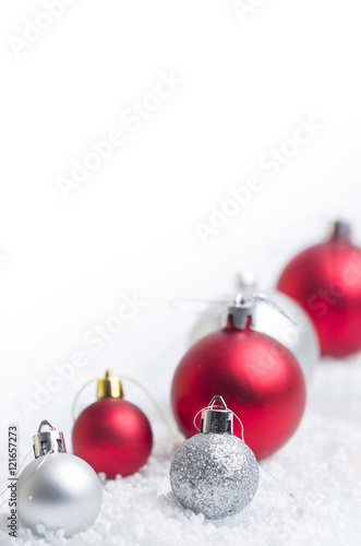 Christmas background with a red and gray balls