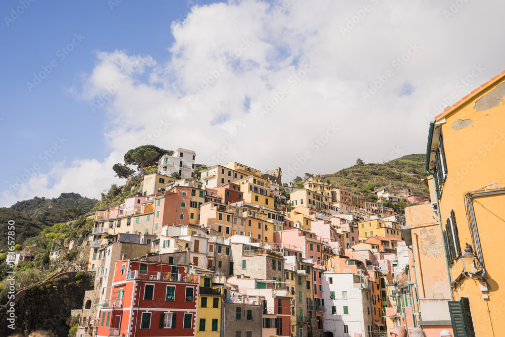 View of riomaggiore village and blue sky and cloud situated is valley of La Spezia , Italy