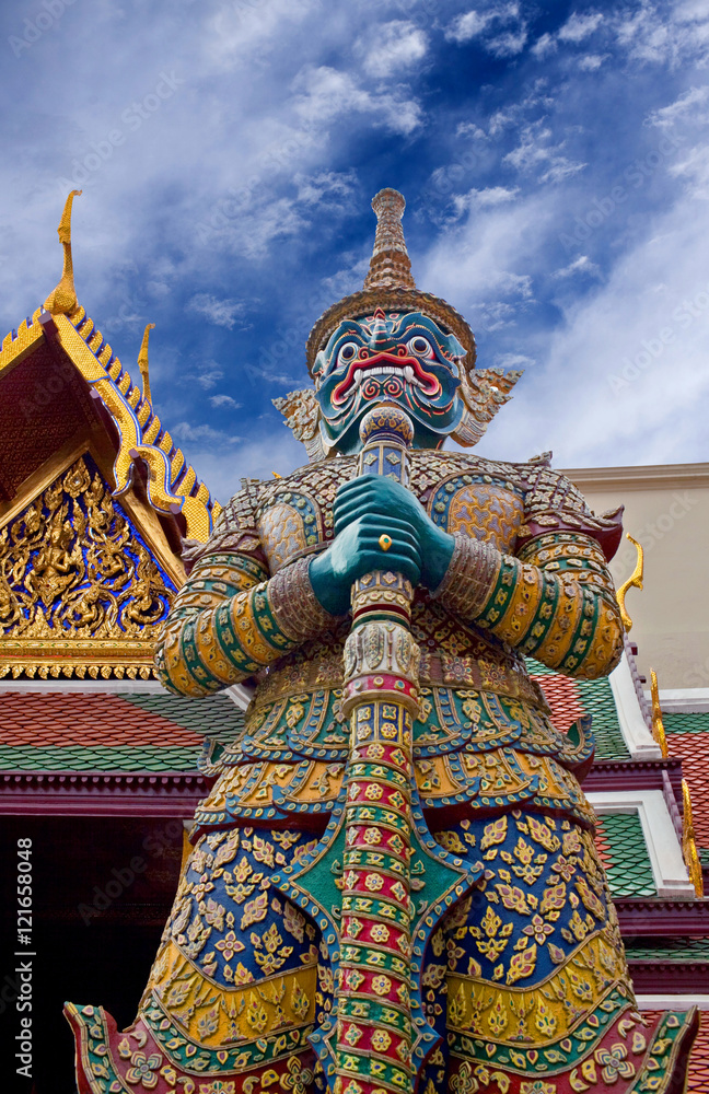 Giant demon Yaksha guarding an exit to Wat Phra Kaew in Bangkok, Thailand.
