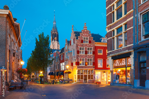Night canal, typical dutch house and Gothic Protestant Nieuwe Kerk, New church, in Delft, Holland, Netherlands