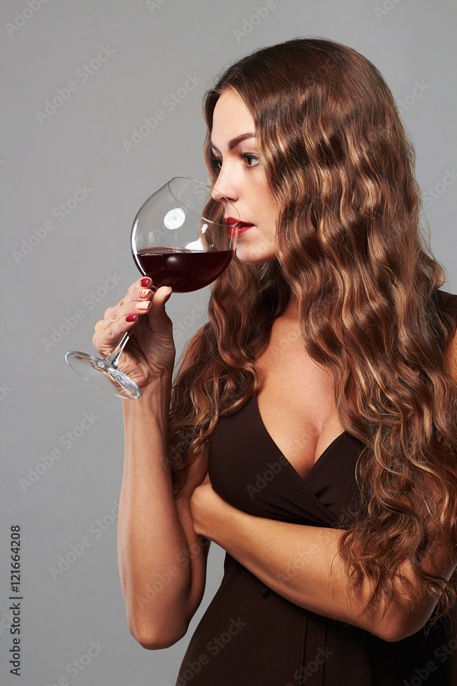 sexy girl with glass of red wine.Beautiful woman drinking wine