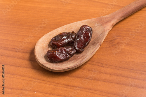 Dried Dates into a spoon. Tamara