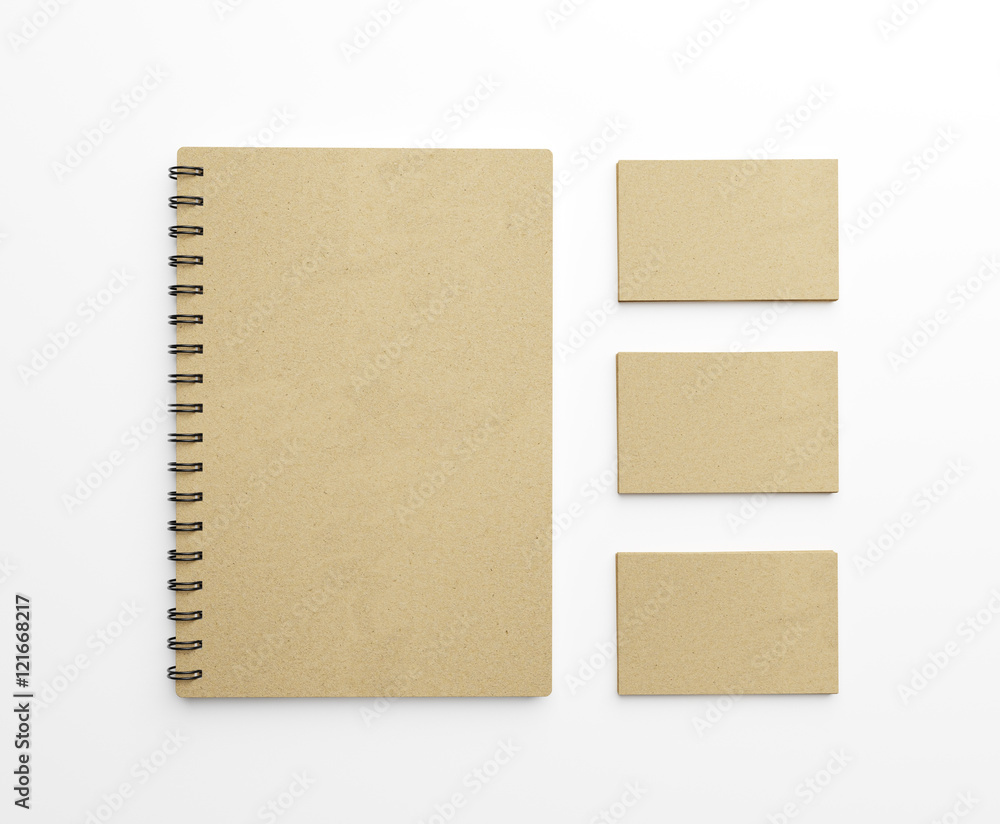 Brown paper notebook and stack of business cards over white background. Top view. 3d rendering Brown paper notebook and stack of business cards over white background. Top view. 3d rendering