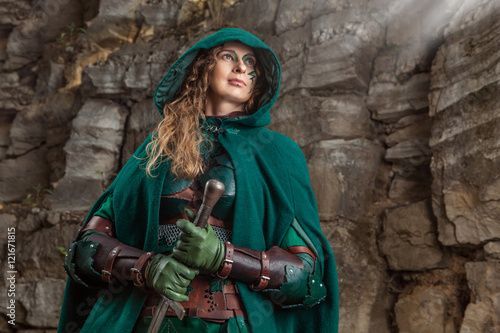 Elf woman in green leather armor with the dagger