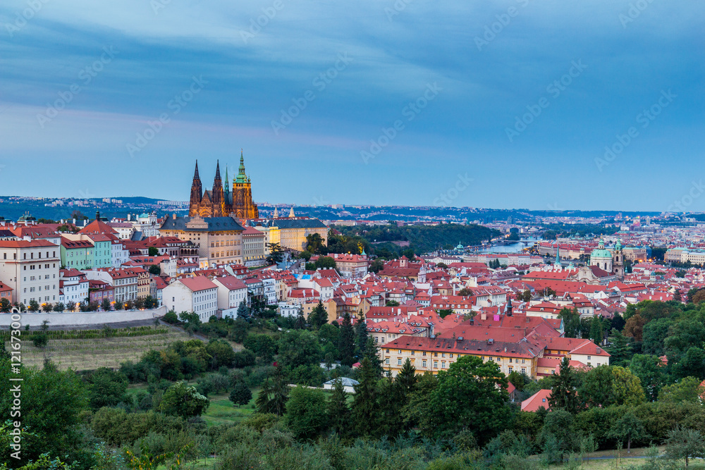Evening summer Prague panorama from Prague Hill with Prague Castle, Vltava river and historical architecture. Concept of Europe travel, sightseeing and tourism.