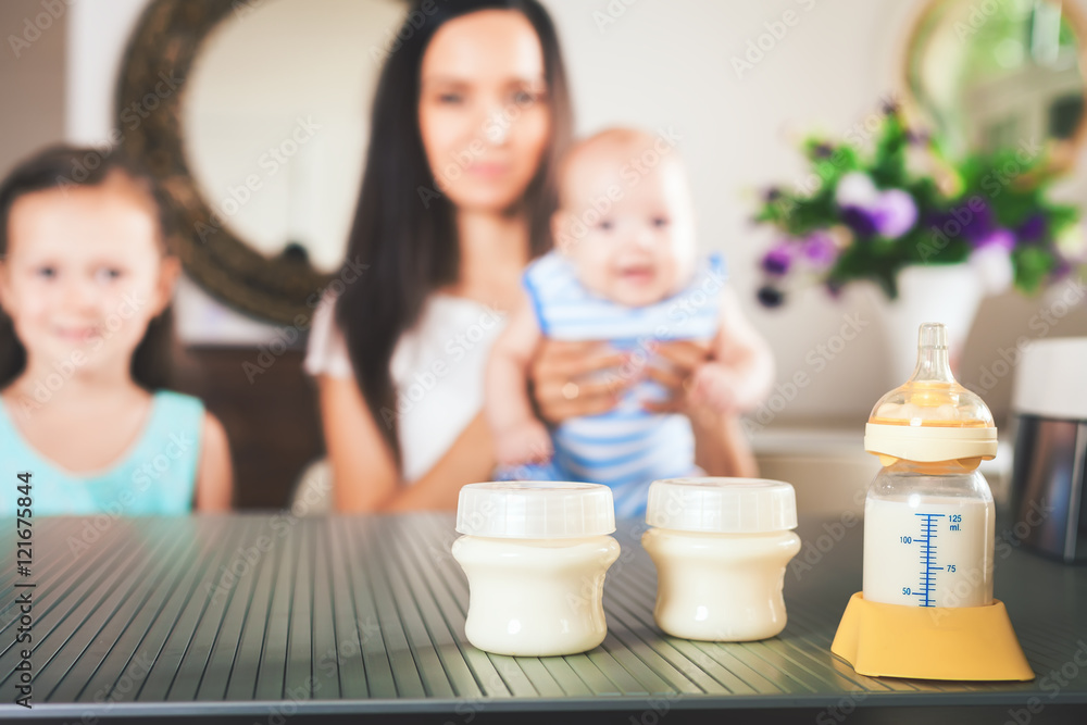 Bottle with milk and manual breast pump Bottle with milk and manual breast pump