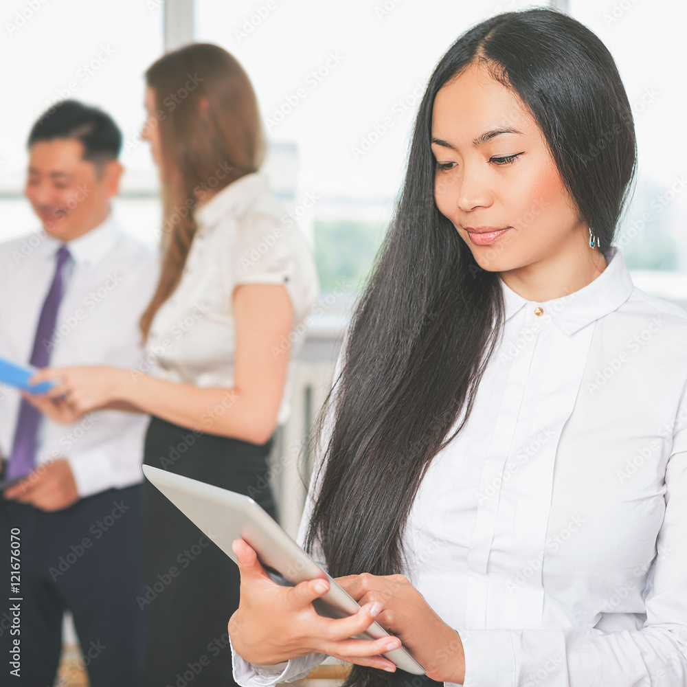 Asian business woman using tablet PC. Online banking