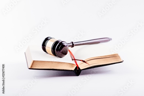 Judge gavel on legal codes.