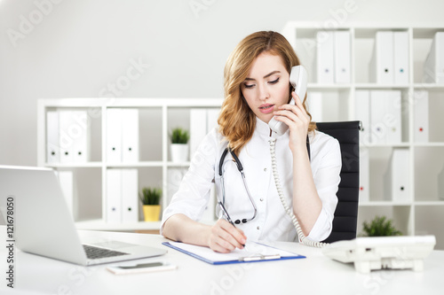 Woman doctor on phone