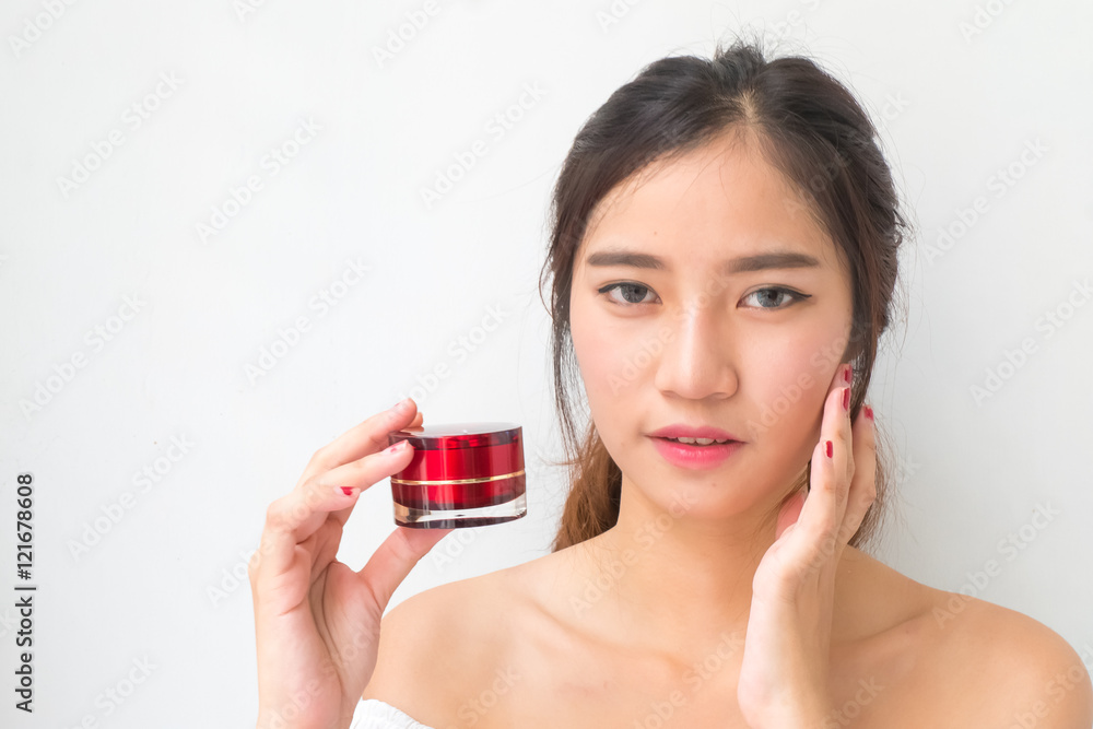 beautiful woman applying cosmetic cream,solated with clipping pa beautiful woman applying cosmetic cream,solated with clipping pa