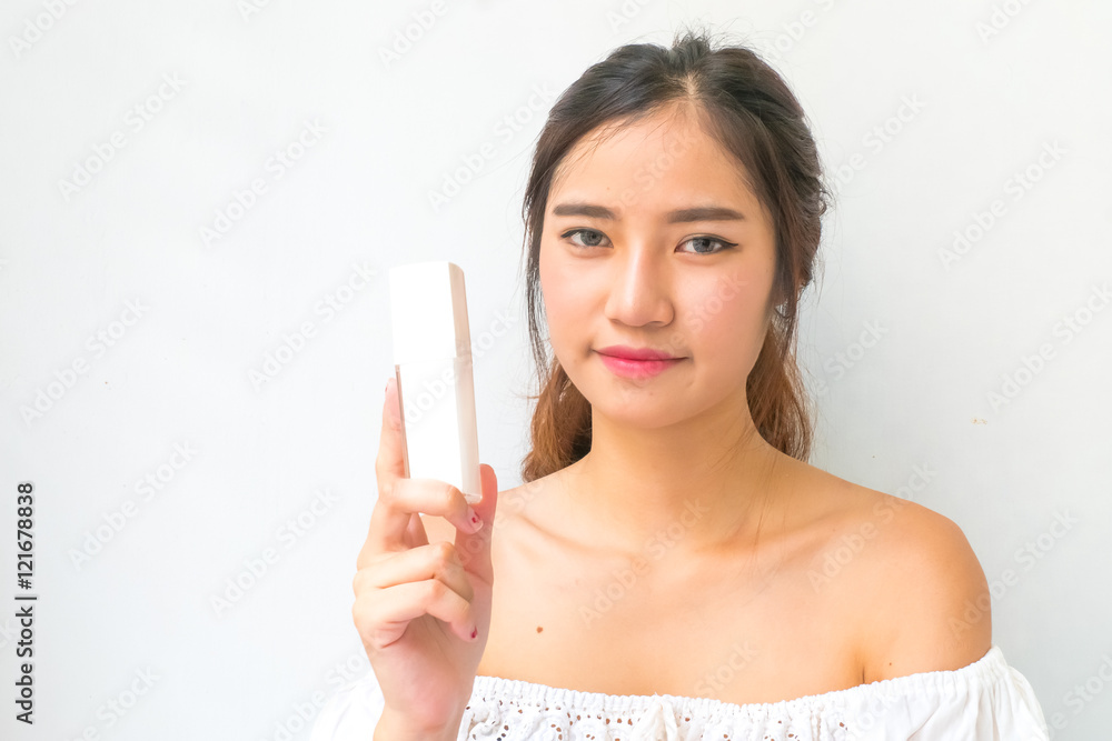 Girl with perfume, young beautiful woman holding bottle of perfu Girl with perfume, young beautiful woman holding bottle of perfu
