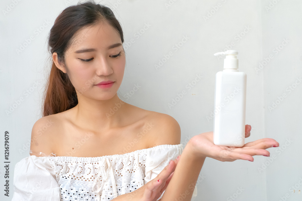 Body lotion Portrait of Beautiful Woman looking at Camera. Beau Body lotion Portrait of Beautiful Woman looking at Camera. Beau