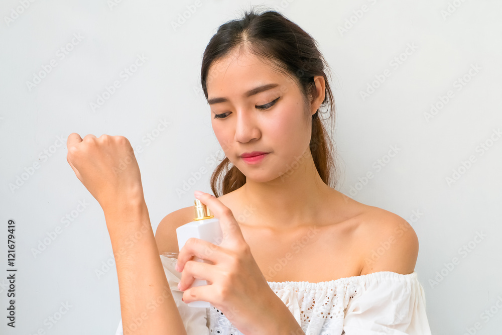 The Girl with perfume, young beautiful woman holding bottle of p The Girl with perfume, young beautiful woman holding bottle of p