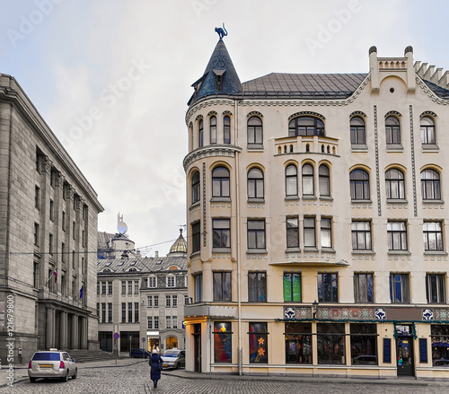 Man near Cat house in Riga at Christmas