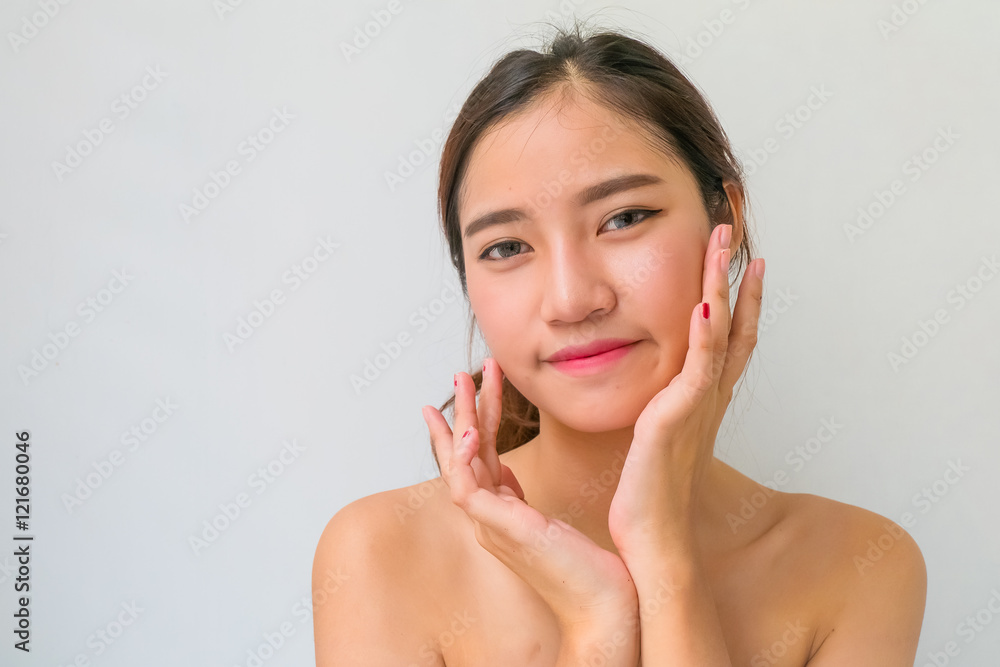 The Portrait of a beautiful female model on white background The Portrait of a beautiful female model on white background