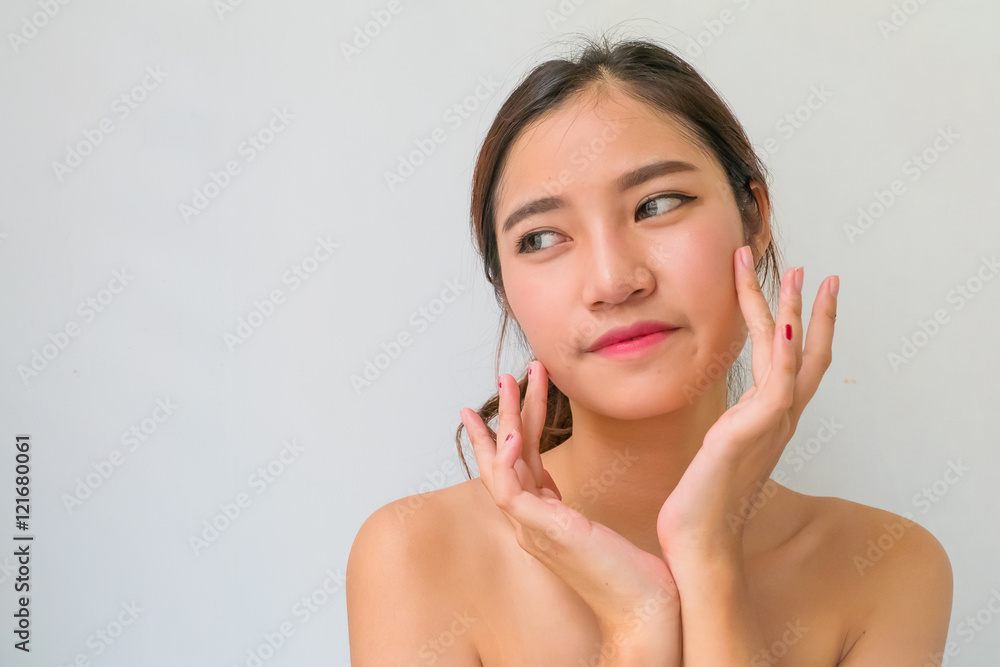 The Portrait of a beautiful female model on white background The Portrait of a beautiful female model on white background