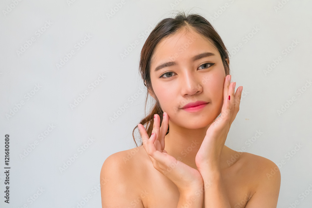 The Portrait of a beautiful female model on white background The Portrait of a beautiful female model on white background
