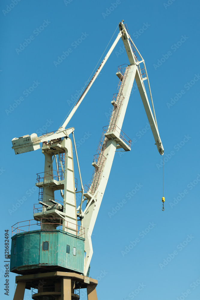 Lonely crane in port. Lonely crane in port.