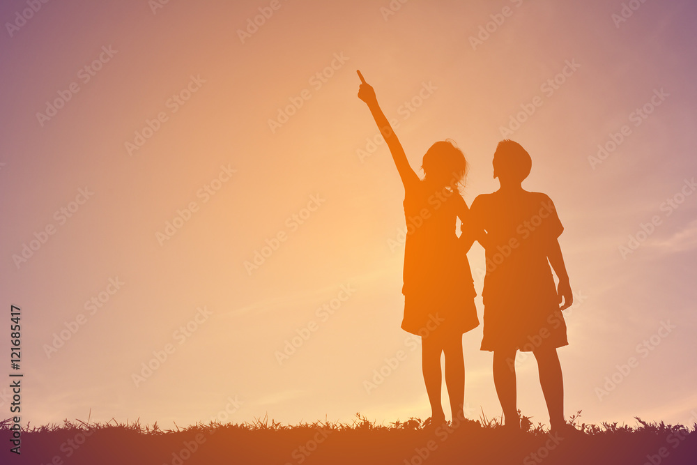 Silhouette children playing on sunset Silhouette children playing on sunset