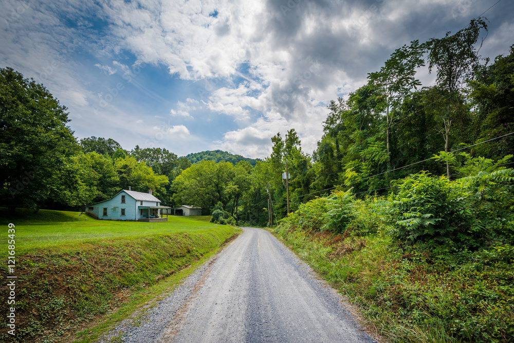 Dirt road and house in the rural Shenandoah Valley, Virginia.