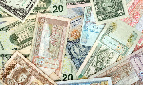 background consisting of randomly mixed banknotes from different countries