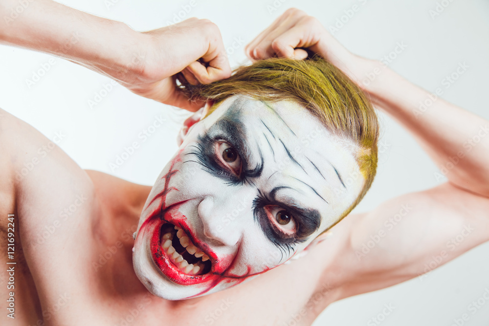Naklejka premium Man with Halloween face art on white background