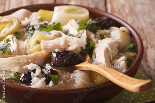 Scottish chicken soup with leeks and prunes macro. Horizontal
 photo