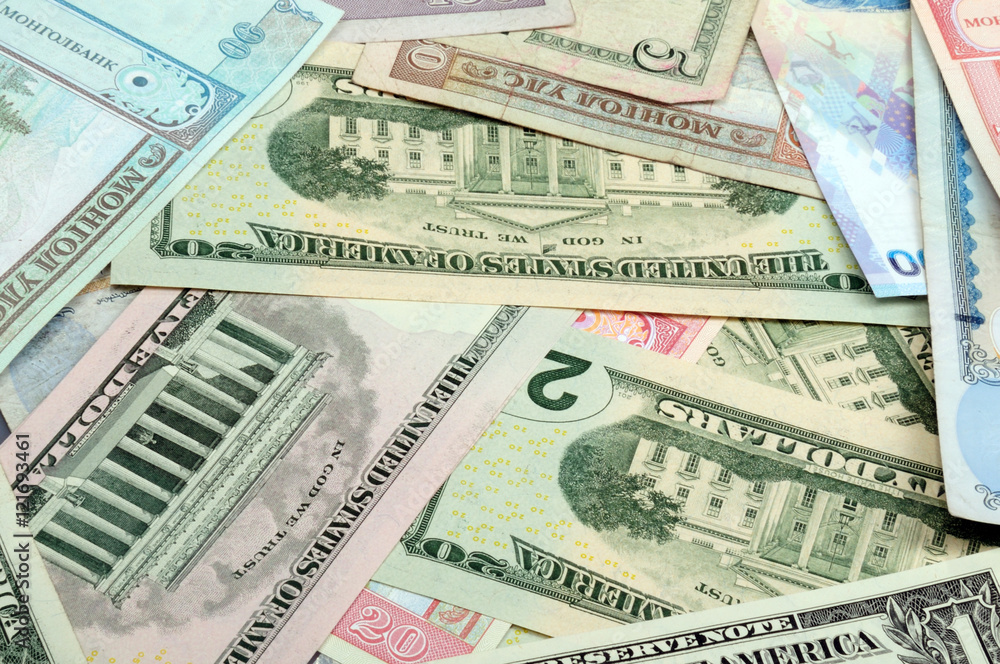 background consisting of randomly mixed banknotes from different countries