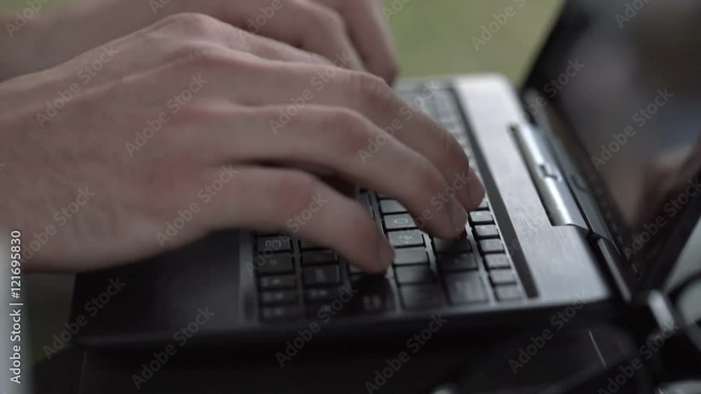 Male hands finish working on laptop, steadycam shot
Male hands finish working on laptop, steadycam shot