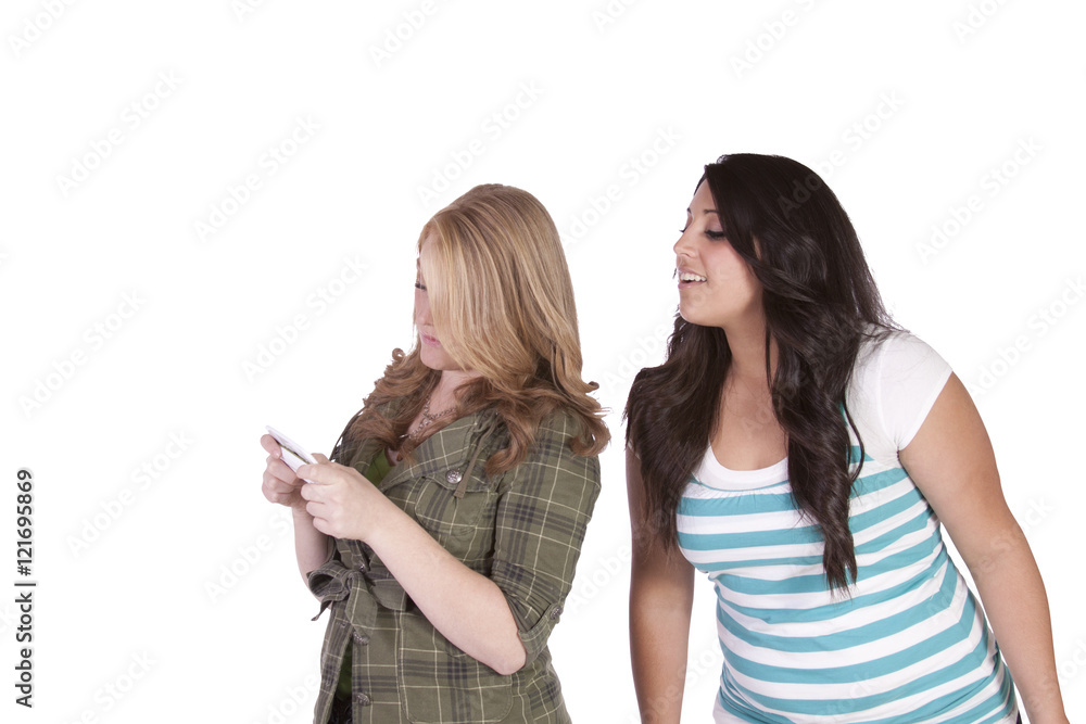 Girl trying to look at her friend's text message Girl trying to look at her friend's text message