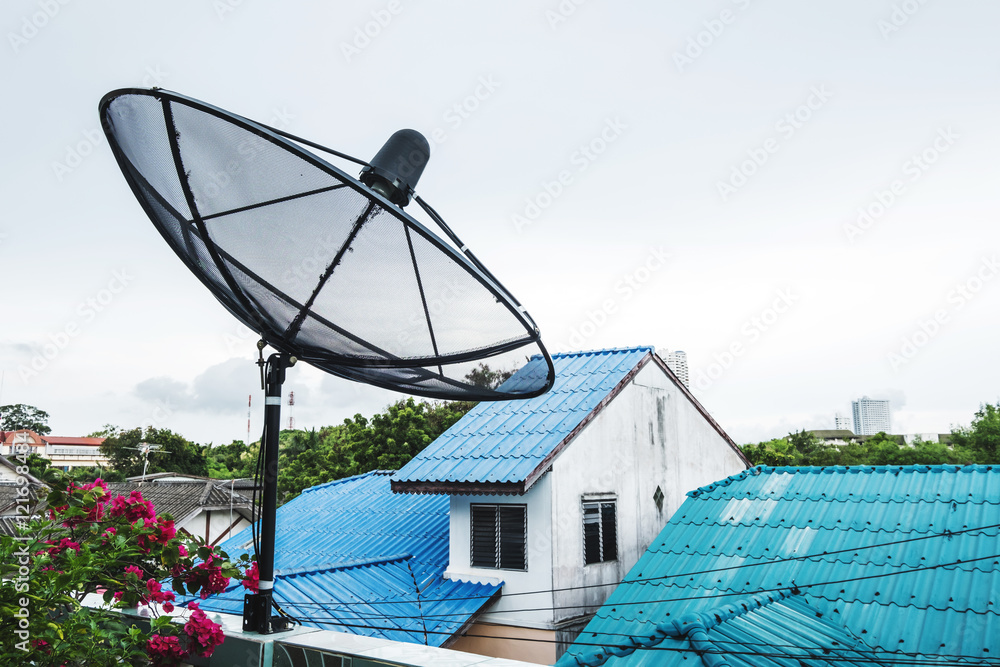 Home Satellite Dish on a roof top in rural area