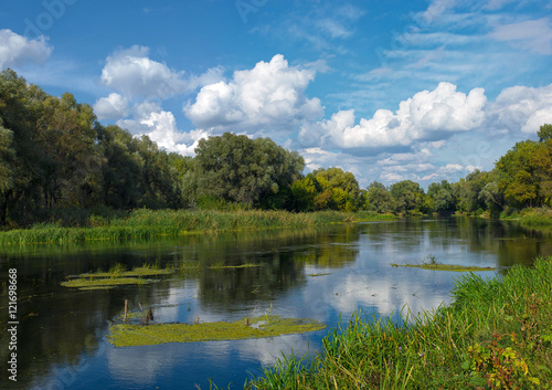 Summer river landscape with clouds