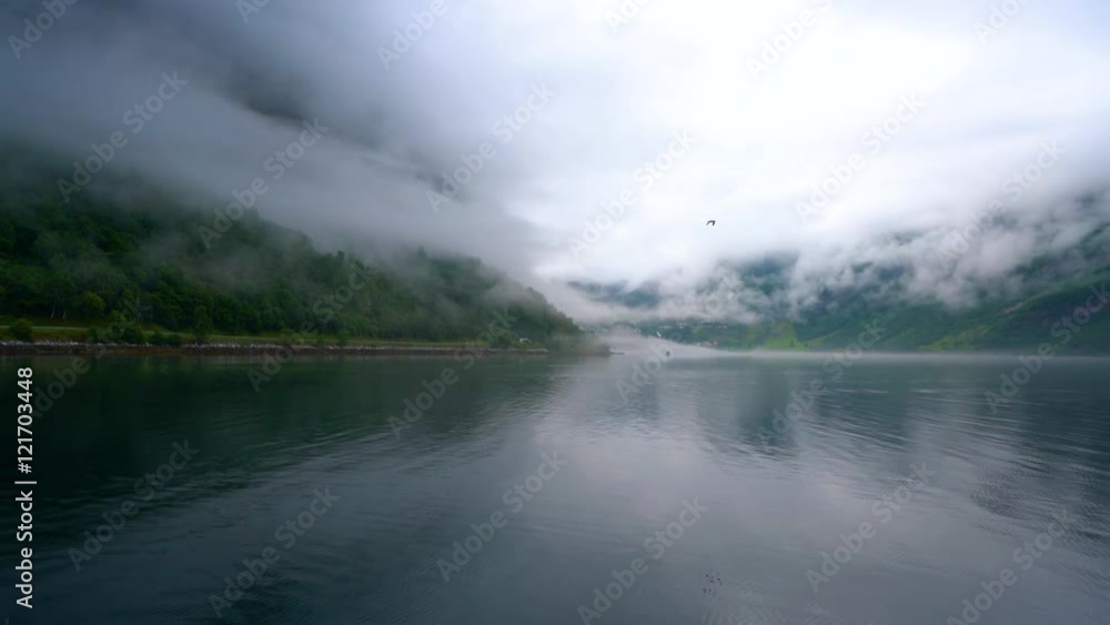 Geiranger fjord, Beautiful Nature Norway. It is a 15-kilometre (9.3 mi) long branch off of the Sunnylvsfjorden, which is a branch off of the Storfjorden (Great Fjord). Geiranger fjord, Beautiful Nature Norway. It is a 15-kilometre (9.3 mi) long branch off of the Sunnylvsfjorden, which is a branch off of the Storfjorden (Great Fjord).