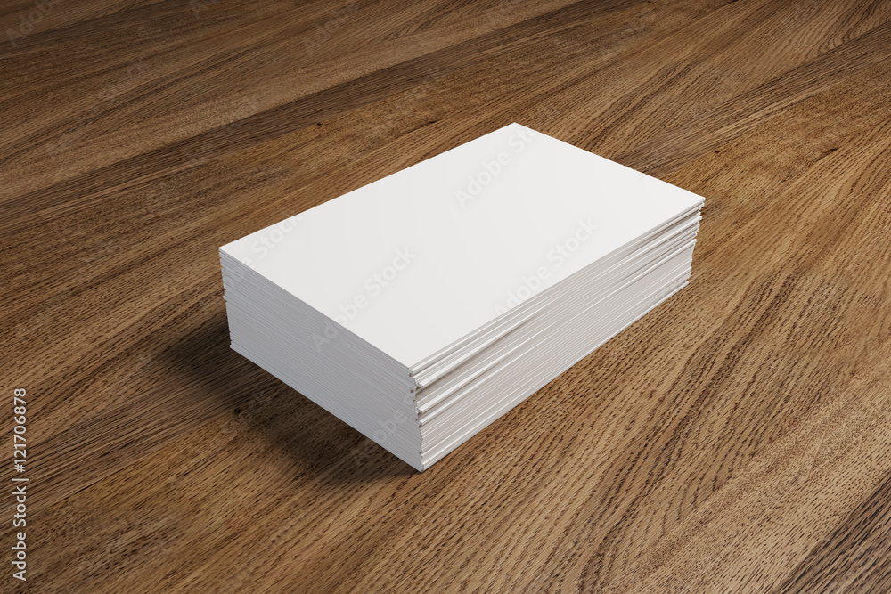Fototapeta premium Stack of white business cards on the wooden table. 3d scene